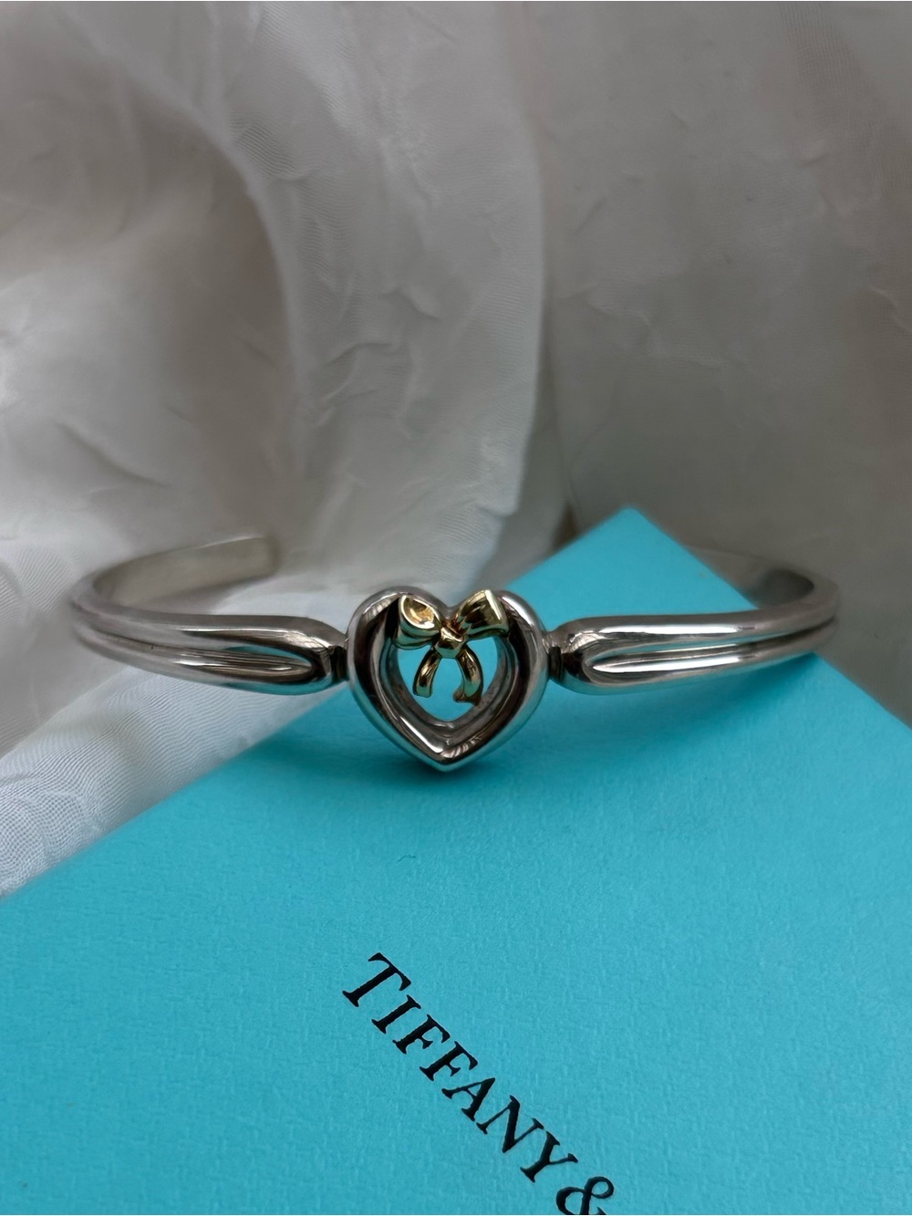 Tiffany & Co. Silver Cuff Bracelet with Gold Bow Heart Accent